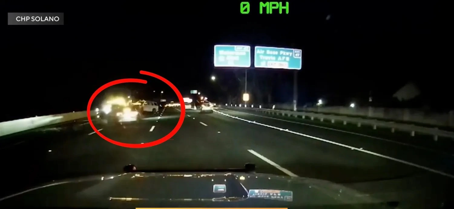 Tesla FSD crash scene showing damaged CHP vehicle and emergency responders on the highway