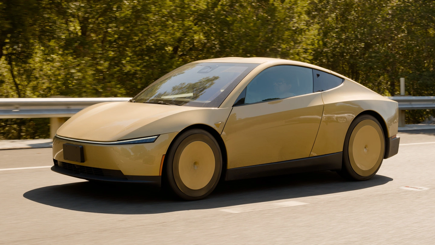 Tesla Cybercab robotaxi displayed at the Paris Auto Show exhibition hall