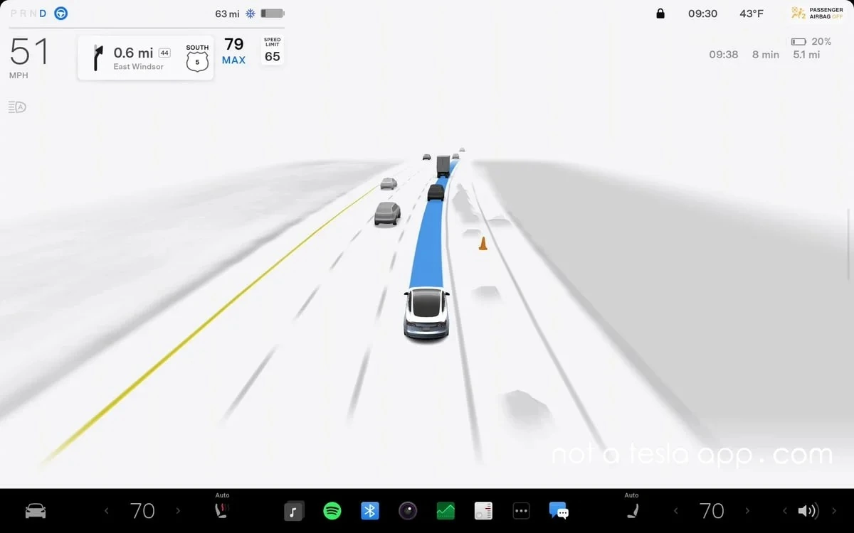 Tesla car navigating a street utilizing the new Tesla FSD pothole avoidance and intelligent routing system