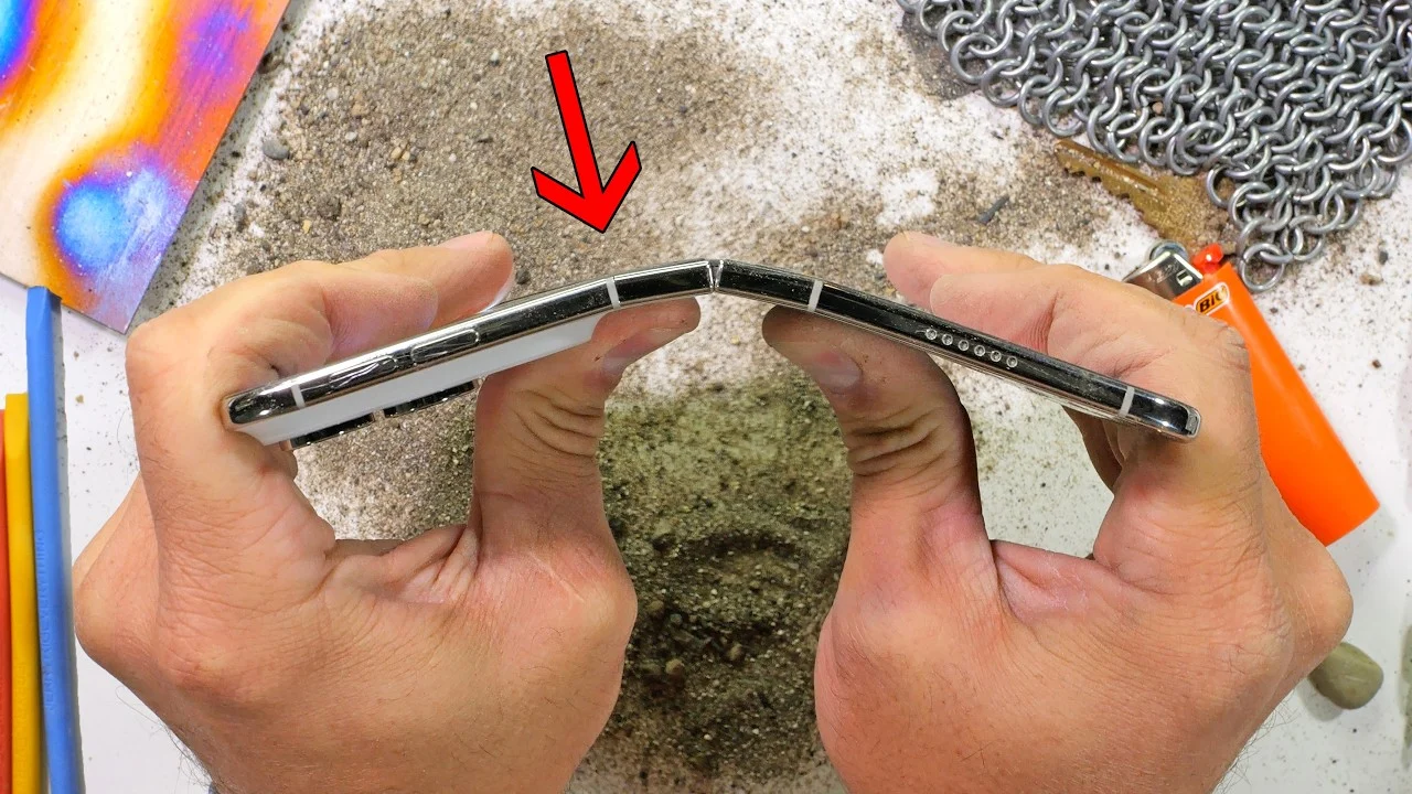 iPhone Duo durability test showing a shattered folding screen and hinge damage