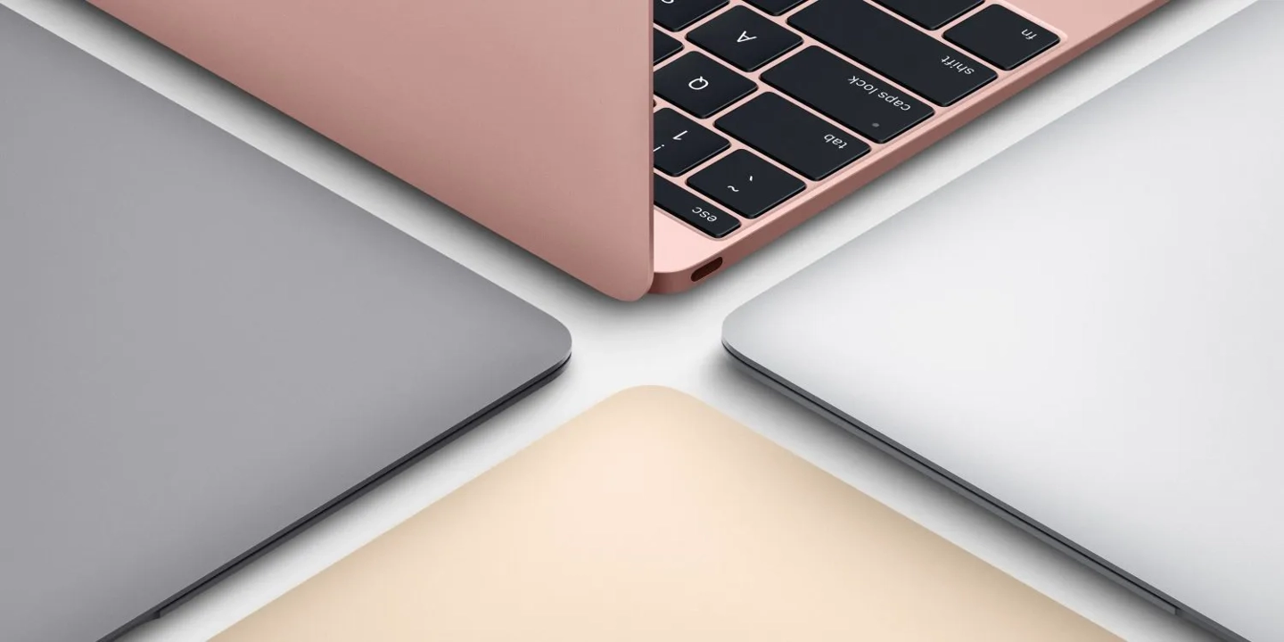 The ultra-thin 2017 12-inch MacBook model displayed on a wooden desk