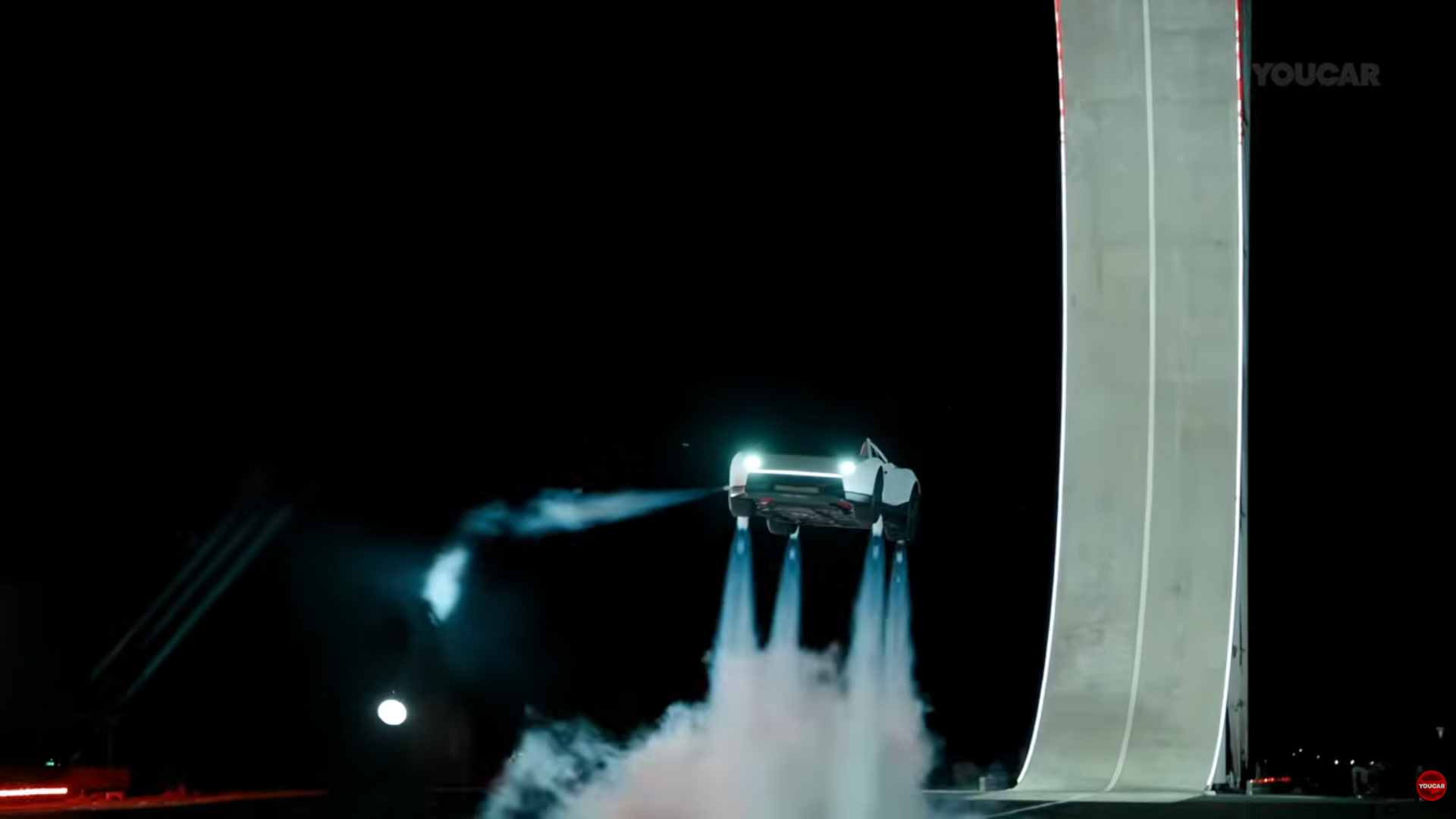 Tesla Roadster flying car soaring above the test ramp using SpaceX thrusters